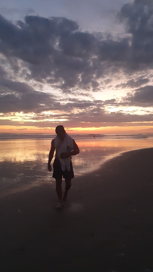 Walking down the beach at sunset in Popoyo with Mono Loco Adventures