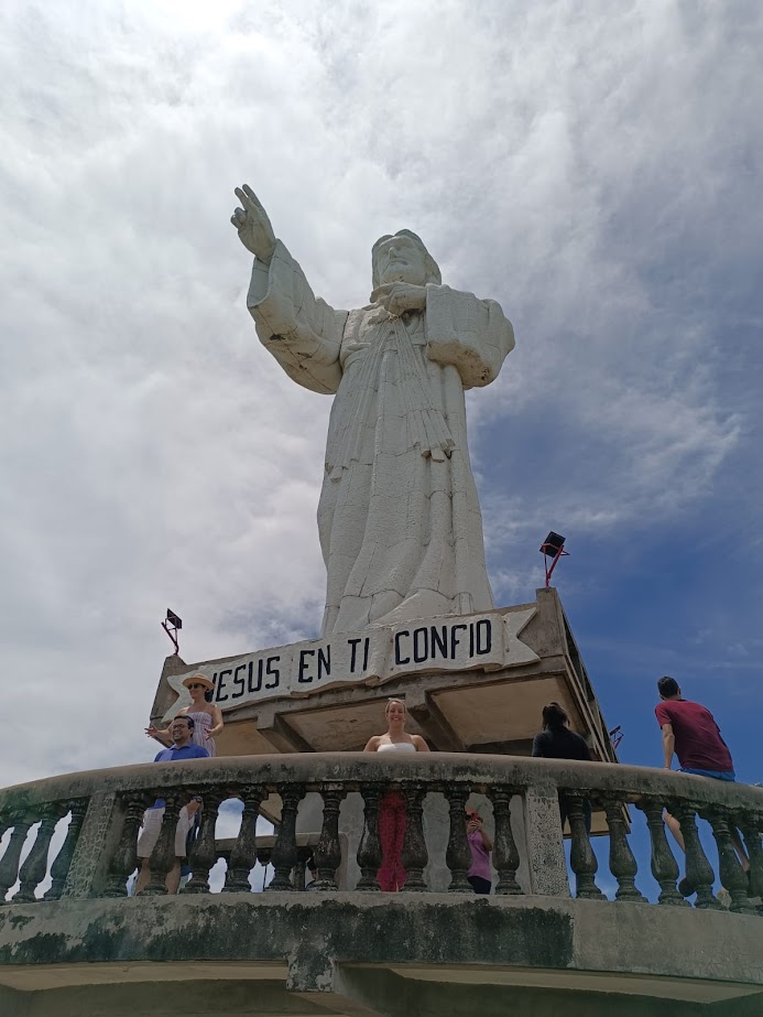 The iconic Cristo de la Misericordia overlooking the bay with Mono Loco Adventures